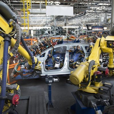 Robots welding car body in car factory